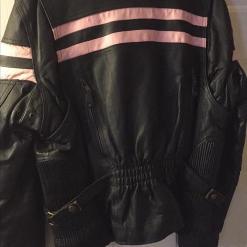 Ladies medium leather jacket with pink stripes.
